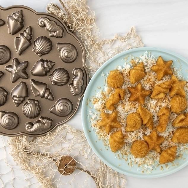 Nordic Ware Forma na minidezerty ve tvaru mořských živočichů, 23 ks, karamelová